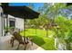 Enjoy outdoor living on this charming patio, complete with comfortable seating and views of the beautifully landscaped backyard at 18202 Abbey Ln, Lutz, FL 33548