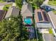 Aerial view of a home featuring a private screened pool and well-maintained landscaping at 2043 Wrangler Dr, Brandon, FL 33511