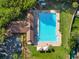 Aerial view of a large community pool with abundant trees and parking at 2043 Wrangler Dr, Brandon, FL 33511