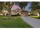 Charming single-Gathering home with a well-maintained lawn, mature trees, and a two-car garage at 2043 Wrangler Dr, Brandon, FL 33511