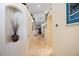 Hallway featuring tile flooring, decorative arched nooks, and neutral wall paint at 2043 Wrangler Dr, Brandon, FL 33511
