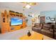 Comfortable living room with entertainment center, large TV, and brown sectional sofa at 2043 Wrangler Dr, Brandon, FL 33511