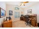 Home office featuring a traditional wooden desk, comfortable chair, and a large window at 2043 Wrangler Dr, Brandon, FL 33511
