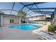 Spacious screened-in pool area with lounge chairs and a well-maintained patio, perfect for outdoor living at 2043 Wrangler Dr, Brandon, FL 33511