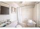A bright bathroom features a sink, toilet, and shower/tub combination at 214 W Hanna Ave # A, Tampa, FL 33604