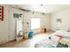 Bedroom includes a window, mirror, and air conditioning unit at 214 W Hanna Ave # A, Tampa, FL 33604