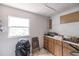 Indoor shot of a kitchen with cabinets and a window at 214 W Hanna Ave # A, Tampa, FL 33604