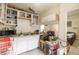 Cozy kitchen space featuring functional cabinets, essential appliances, and tile flooring at 214 W Hanna Ave # A, Tampa, FL 33604