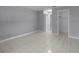 Spacious bedroom featuring a closet with tiled floor and view to a hallway at 2481 12Th Sw Ave, Largo, FL 33770