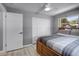 Bedroom featuring a spacious closet, ceiling fan and a window overlooking backyard at 2481 12Th Sw Ave, Largo, FL 33770