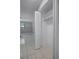 Bedroom closet with white louvered door and interior view of a tiled floor at 2481 12Th Sw Ave, Largo, FL 33770