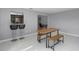Bright dining area with tiled floor, features a modern table set with benches and breakfast bar at 2481 12Th Sw Ave, Largo, FL 33770