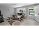 Bright living room featuring a large window, light wood floors, and a comfortable sectional sofa at 2481 12Th Sw Ave, Largo, FL 33770