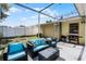 This patio features outdoor seating, string lights, and a barbeque grill at 2481 12Th Sw Ave, Largo, FL 33770