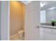 This bathroom features a toilet and gray countertop with storage at 2487 Golden Pasture Cir, Clearwater, FL 33764