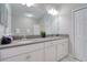 Bright bathroom with a double sink vanity and a large mirror at 2487 Golden Pasture Cir, Clearwater, FL 33764