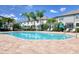 Community pool area with plenty of seating and a covered area at 2487 Golden Pasture Cir, Clearwater, FL 33764