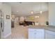 Open-concept kitchen flows into the bright living area, creating an inviting atmosphere at 2487 Golden Pasture Cir, Clearwater, FL 33764