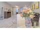 Stylish living room area with modern furniture, decor, and lots of light from the dining area at 2487 Golden Pasture Cir, Clearwater, FL 33764