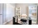 Bright office with a glass-top desk and a large closet at 2487 Golden Pasture Cir, Clearwater, FL 33764