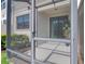 A screened in outdoor patio area with view to the outside at 2487 Golden Pasture Cir, Clearwater, FL 33764