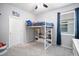bedroom with a loft bed with built-in storage, carpet flooring, and natural light at 2513 Knight Island Dr, Brandon, FL 33511
