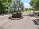 Gated community entrance with lush landscaping and mature trees at 2513 Knight Island Dr, Brandon, FL 33511