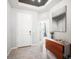 Inviting entryway with tile flooring, a stylish console table, and a white front door at 2513 Knight Island Dr, Brandon, FL 33511