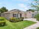 Beautiful single-story home with a three-car garage and well-manicured lawn at 2513 Knight Island Dr, Brandon, FL 33511