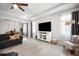 Bright and airy living room with a TV, white cabinets, and comfortable seating at 2513 Knight Island Dr, Brandon, FL 33511