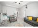 Open living room with a ceiling fan, tiled floors, and comfortable seating area at 2513 Knight Island Dr, Brandon, FL 33511