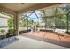 Spacious screened lanai with a swing, playhouse, and ample seating at 2513 Knight Island Dr, Brandon, FL 33511