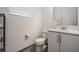 Well-lit powder room featuring a modern vanity and neutral color palette at 3197 Acacia Bay Ave, Wesley Chapel, FL 33543