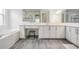 Elegant bathroom featuring double sinks, quartz countertops, soaking tub and walk-in shower at 3197 Acacia Bay Ave, Wesley Chapel, FL 33543