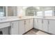 Elegant bathroom featuring double sinks, quartz countertops, and modern fixtures at 3197 Acacia Bay Ave, Wesley Chapel, FL 33543