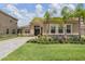 Charming single-story home with well-maintained lawn and mature palm trees in the front yard at 3197 Acacia Bay Ave, Wesley Chapel, FL 33543