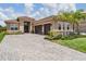 Lovely home with paver driveway, manicured lawn, and attached two car garage at 3197 Acacia Bay Ave, Wesley Chapel, FL 33543