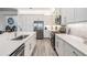 Modern kitchen features stainless steel appliances, white cabinets, and a sleek design at 3197 Acacia Bay Ave, Wesley Chapel, FL 33543