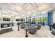 A stylish resident lounge features modern seating, chic decor, and expansive windows at 3197 Acacia Bay Ave, Wesley Chapel, FL 33543