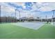 Well-lit pickleball court provides an ideal space for friendly matches and outdoor exercise with a shaded area nearby at 3197 Acacia Bay Ave, Wesley Chapel, FL 33543