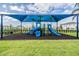 A colorful playground is equipped with slides and climbing structures, providing a fun and safe environment for children at 3197 Acacia Bay Ave, Wesley Chapel, FL 33543