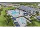 Aerial view of the community pool with ample seating and resort-style amenities at 3197 Acacia Bay Ave, Wesley Chapel, FL 33543