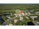 Wide aerial of the houses in the neighborhood with community ponds and mature trees at 3337 Crescent Oaks Blvd, Tarpon Springs, FL 34688