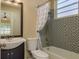 Bathroom with combined tub and shower, vanity and toilet at 3337 Crescent Oaks Blvd, Tarpon Springs, FL 34688