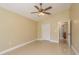 Bedroom with tile flooring and ceiling fan at 3337 Crescent Oaks Blvd, Tarpon Springs, FL 34688