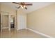 Bedroom with tile floors and neutral walls at 3337 Crescent Oaks Blvd, Tarpon Springs, FL 34688