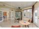 Bright, tiled game room with pool table, sitting area, and view to other rooms at 3337 Crescent Oaks Blvd, Tarpon Springs, FL 34688