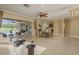Open concept living room with view of dining area and pool at 3337 Crescent Oaks Blvd, Tarpon Springs, FL 34688