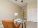 Office with glass desk, ceiling fan, and view to the hallway at 3337 Crescent Oaks Blvd, Tarpon Springs, FL 34688