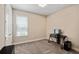 Bedroom with a window, a small desk, neutral walls, and carpeted flooring at 3532 Wicket Field Rd, Lutz, FL 33548